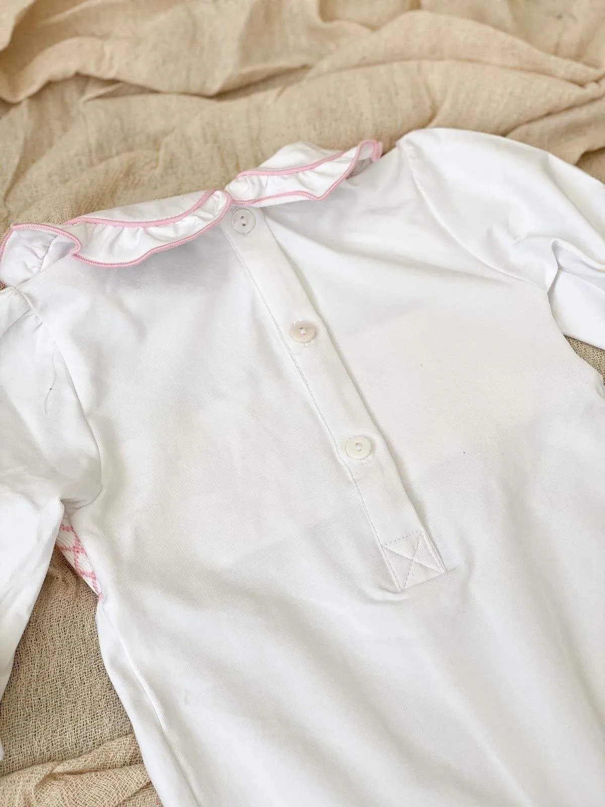 Girls smocked baby grow - white trimmed with pink