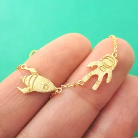 Spaceship and Astronaut Space Travel Themed Charm Necklace in Gold | DOTOLY