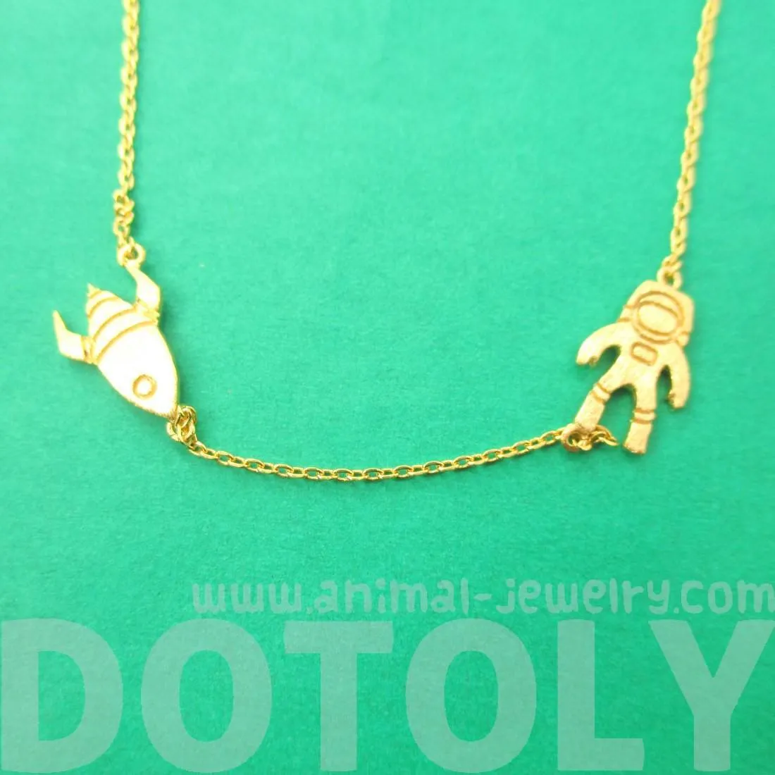 Spaceship and Astronaut Space Travel Themed Charm Necklace in Gold | DOTOLY